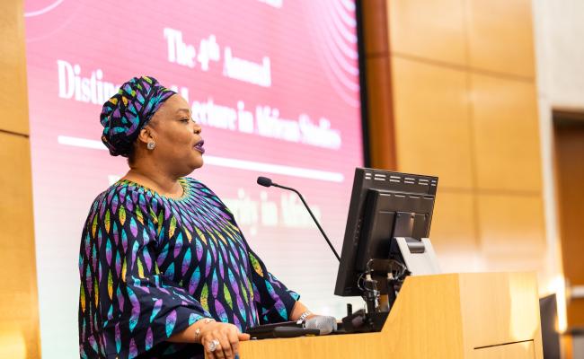 Madam Leymah Gbowee speaking from a podium