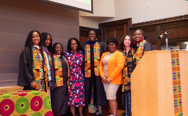 2025 Africana Studies Graduates posing with Dr. Marcia Chatelain and Carol Davis.