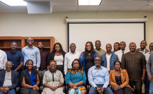 CFAS Director Wale Adebanwi (leftmost), UGhana Head of International Partnerships Nadia Kokui Torsu (front, third from left), and Africana Studies Librarian Mercy K. Ayilo sit amongst master's students from UGhana School of Law