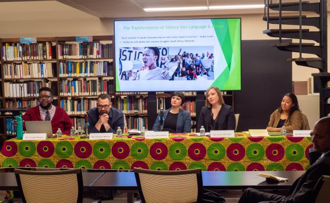 The panelists listen intently to an audience question.