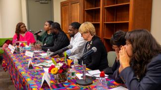 Panelists answering questions during the last panel of the event.